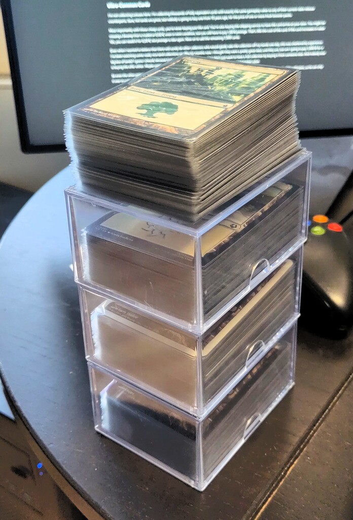 Jewel cases and stacks of sleeved cards