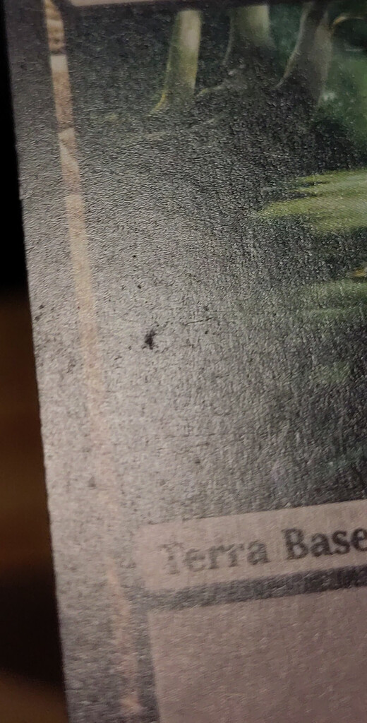 Damage cluster on a card front.