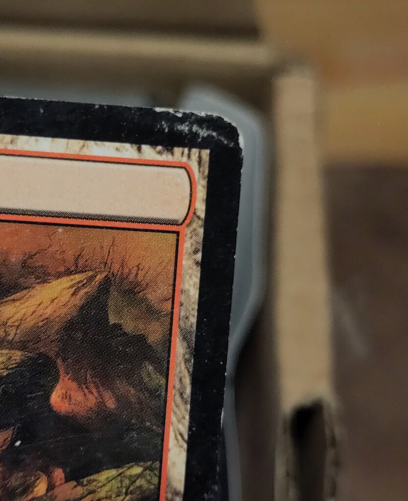 Folding damage on a card corner.