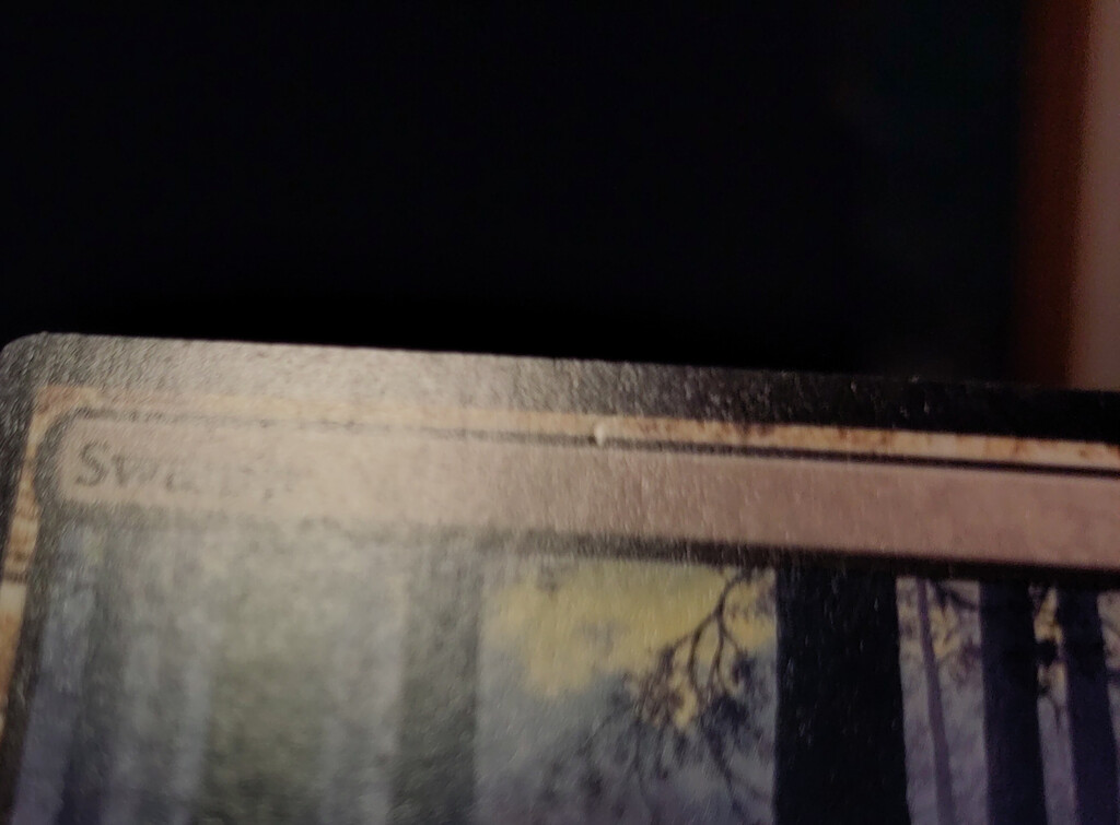 Another finger nail impression on a card front.